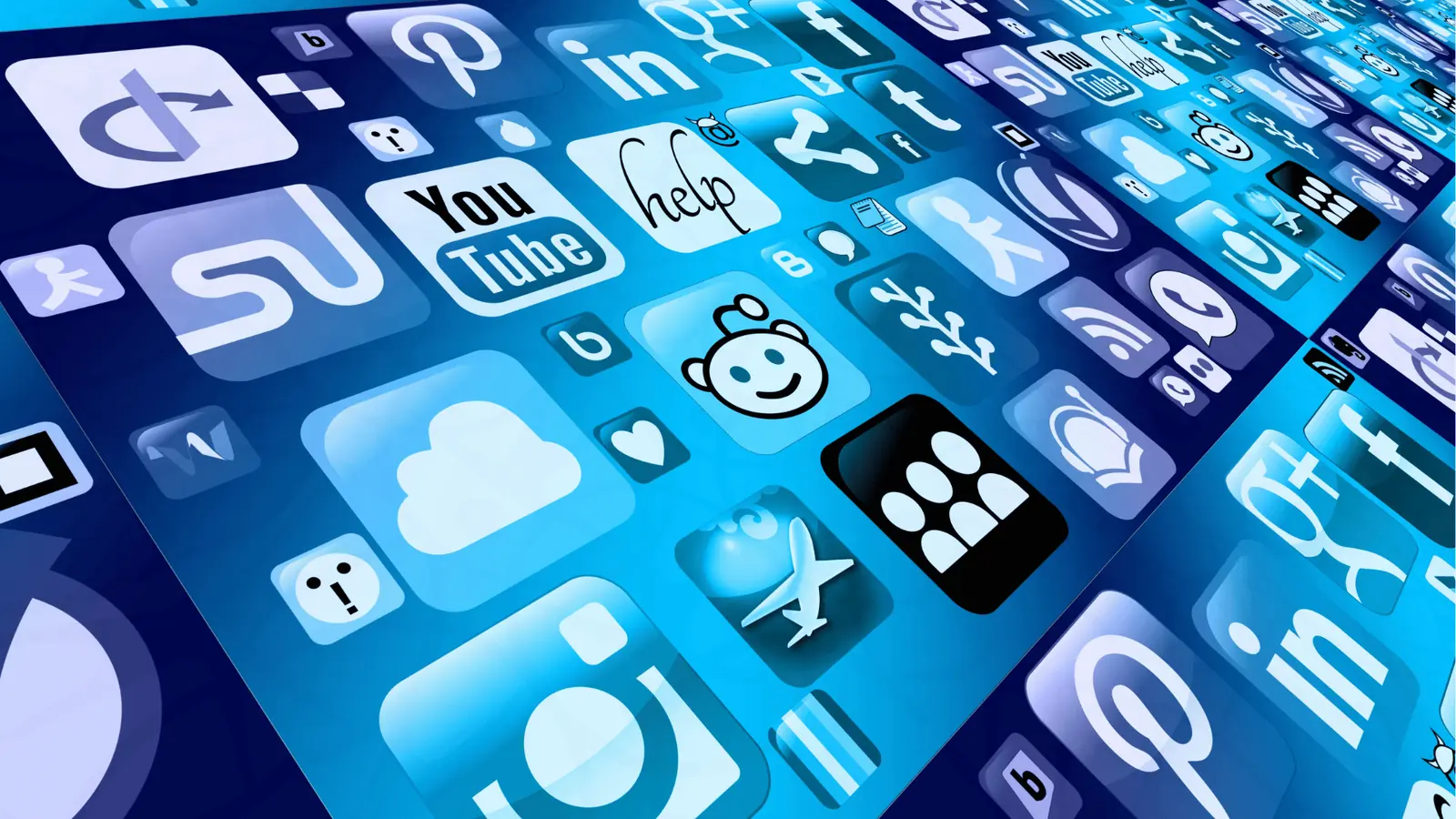Tilted collage of blue social media and app icons on a digital surface for scheduling