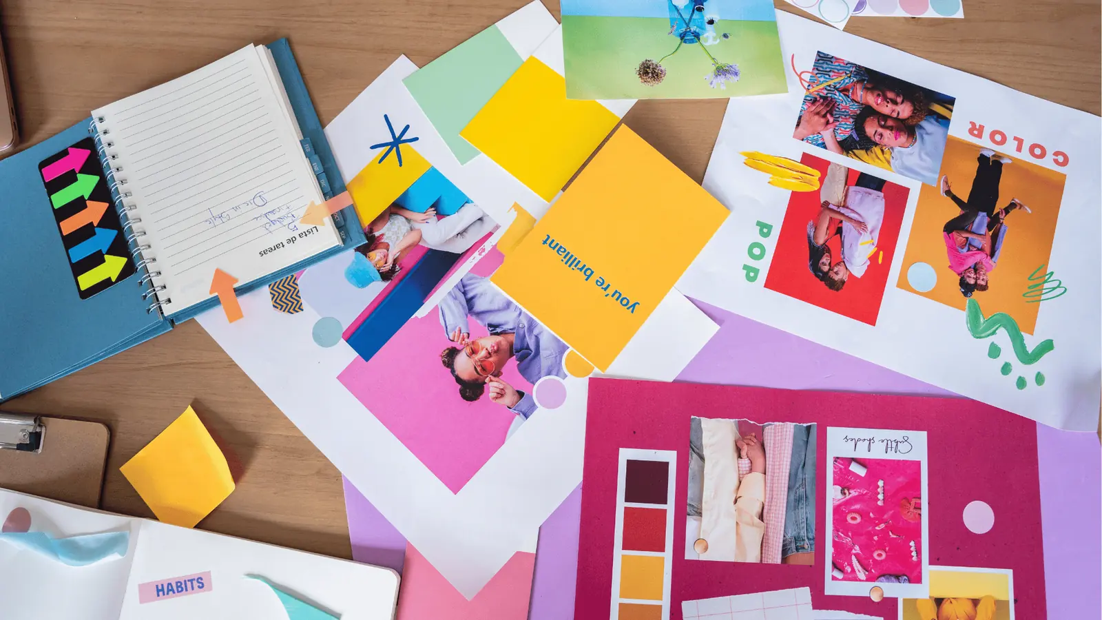 Overhead flatlay of colorful moodboard, photo prints, notebook, and sticky notes