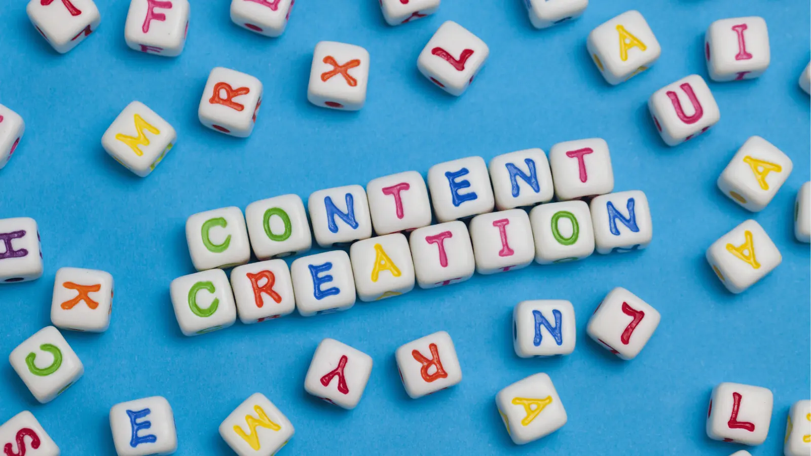 Letter beads spelling content creation, representing the agency content approval process