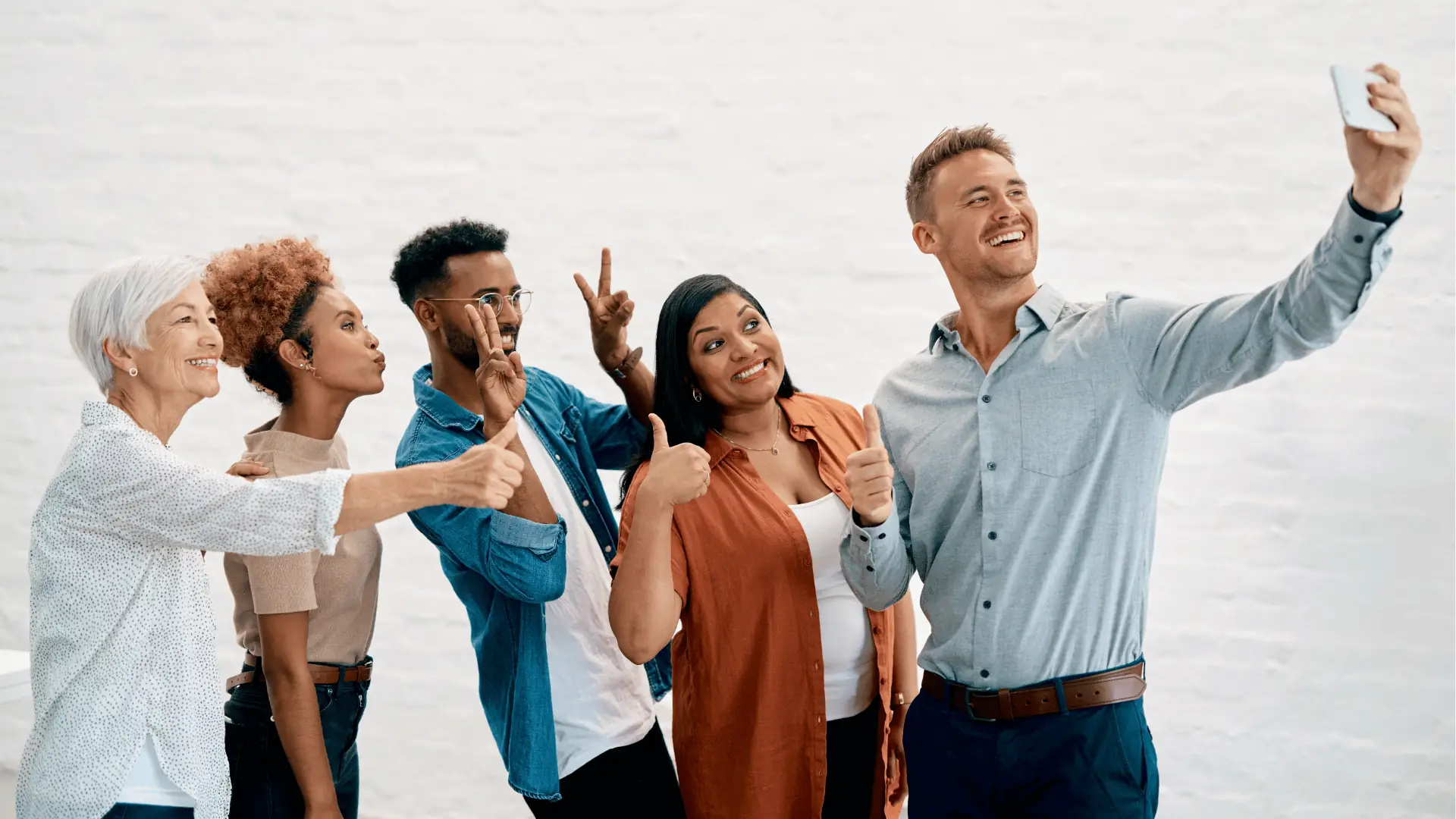 Diverse group smiling for a selfie