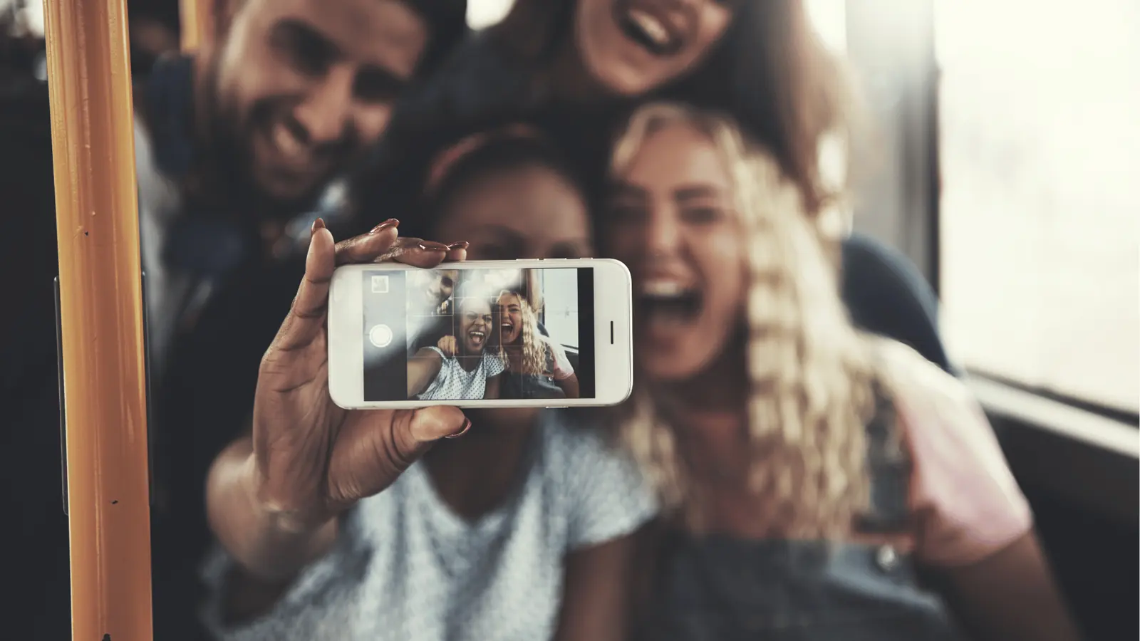 Happy group taking a selfie on a smartphone