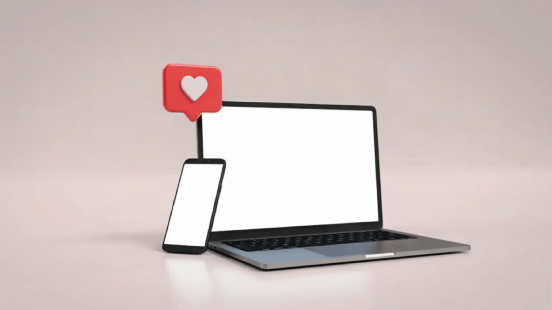 Laptop and smartphone with blank screens and red heart notification icon for multi-brand management