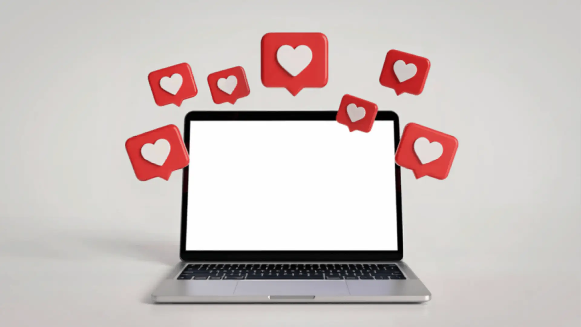 Open laptop with blank screen and floating red heart notification icons