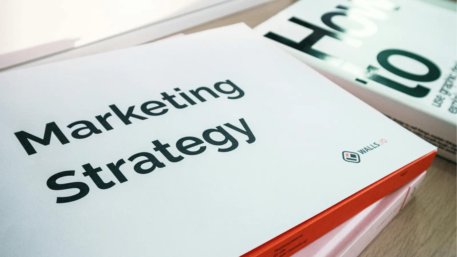 Close-up of a printed Marketing Strategy book with red spine