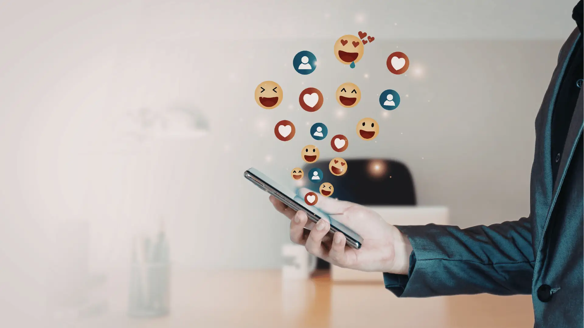 Hand holding smartphone with floating social reaction emojis and user icons for reporting