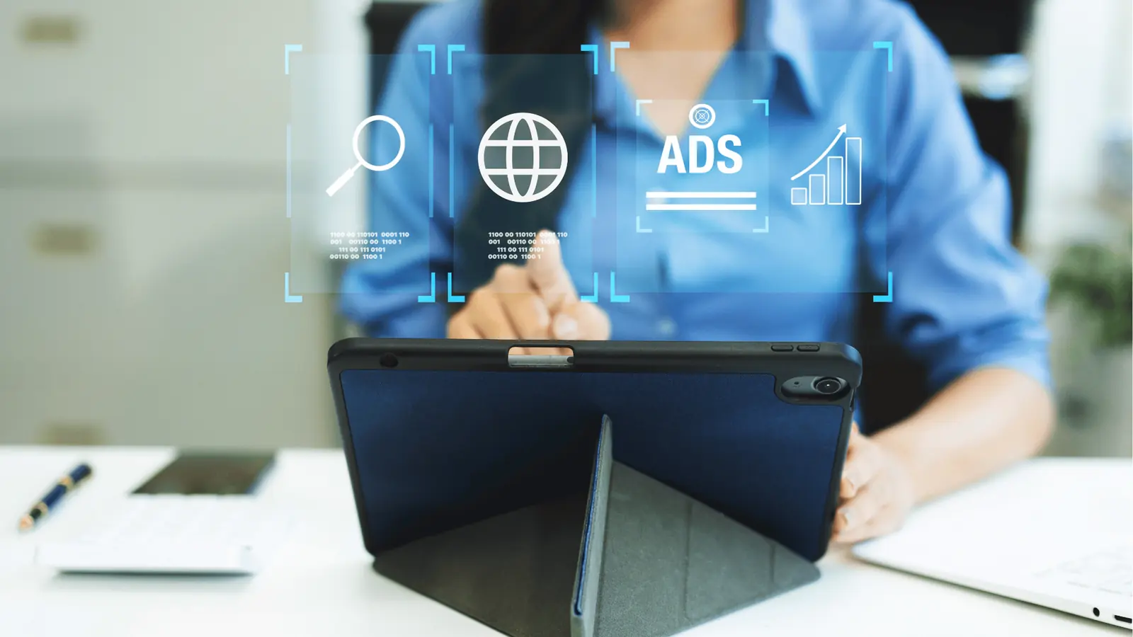 Person tapping a tablet with overlaid digital ads and web icons for multi-brand management