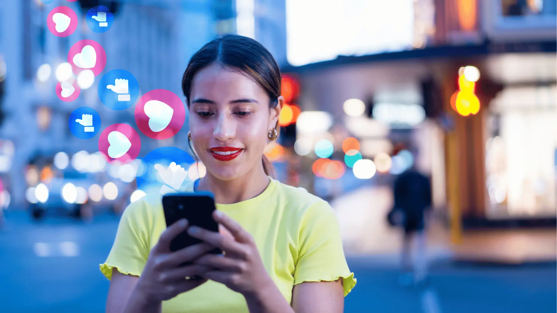 Young woman looking at smartphone with floating social reaction icons beside her for analytics
